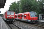 Am 18.7.2011 trifft 143 241-8 als S6 nach Essen Hbf in Hösel (S) auf den Gegenkurs nach Köln-Nippes.